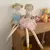 Muñeca de tela con moños Azul o Rosa en internet