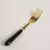 Tenedor acero dorado mango negro 15 cm