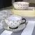 Taza tipo "mug" flor negra