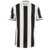Camisa de torcedor do Botafogo I 24/25, com design elegante em preto e branco, destacando listras verticais e o logo da Reebok na parte traseira.