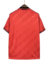 Camisa vermelha do Flamengo 24/25, vista traseira, com detalhes em preto.