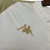 Detalhe do logo Kappa em dourado na camisa feminina do Vasco da Gama III 24/25.