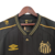 Camisa retrô do Santos Futebol Clube, edição comemorativa, com detalhes em dourado e logo da Umbro.