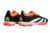 Chuteira Society Adidas Predator 24 Elite na cor preta com detalhes em laranja e amarelo, vista de trás.