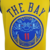 Camiseta regata amarela do Golden State Warriors com o texto "THE BAY" e um desenho azul na parte frontal.