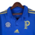 Camisa retrô azul do Palmeiras com detalhes em dourado, incluindo emblema dos 100 anos do clube e logotipo da Adidas.