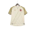 Camisa feminina bege do Vasco da Gama III 24/25, com detalhes em dourado e o escudo do time em vermelho.
