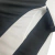 Detalhe da camisa Nike Corinthians III 2024/25 masculina, destacando as cores preto e branco e o design do tecido.