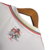 Camisa retrô do São Paulo, edição memorial 1992, com detalhes em preto, branco e vermelho, destacando a imagem de Telê Santana no verso.