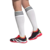 Chuteira Society Adidas Predator 24 Elite em uso, destacando design moderno com cores preto, vermelho e detalhes em amarelo.