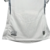 Camisa branca do Santos Futebol Clube, modelo 24/25, com estampa do estádio em relevo e etiqueta na barra.