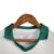 Colete infantil branco com gola verde, parte superior do uniforme da Puma para o Palmeiras II 24/25.