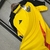 Camisa de treino amarela do Atlético Mineiro, modelo 25/26, da Adidas, com detalhes em preto e vermelho.