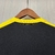 Camisa de treino do Atlético Mineiro, modelo 25/26, na cor preta com detalhes em amarelo e laranja, fabricada pela Adidas.