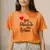 Camiseta Feminina Estampada "Que A Felicidade Vire Rotina"
