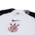 Camisa-oficial-Corinthians-25-26-Home-I-Torcedor-Nike-branca-com-detalhes-em-preto-e-escudo-do-Corinthians-no-centro