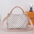 Hermosa cartera con correa trenzada