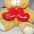 Urso de Pelúcia Com Amor 25cm com Dois Corações Vermelhos – Presente para Namorados e Datas Especiais - PLUFFIE