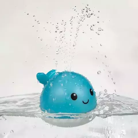Baleia esguicha água com luz da buba