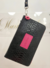 Billetera/Portadocumentos Amelie negra con fucsia