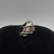 Anillo de plata espiral con piedra roja en internet