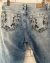 Calça Jeans Bolso Bordado na internet