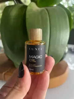 Óleo multifuncional cabelo e corpo Luxel - Lu Cosméticos e perfumaria LTDA