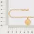 PULSEIRA COM PINGENTE ELEMENTOS MAR BANHADA A OURO 18K - TAM.19 5521121900 na internet