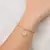 PULSEIRA COM PINGENTE ELEMENTOS MAR BANHADA A OURO 18K - TAM.19 5521121900 - comprar online