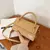 Bolsa Crossbody texturizado elegante na internet