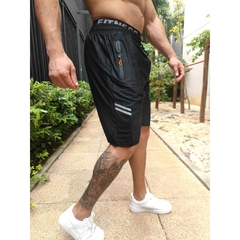 SHORTS DRY FIT PLUS COM ZIPER NO BOLSO na internet