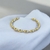 BRACELETE TORCIDO ESPACO DOURADO