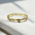 BRACELETE TORCIDO FLORES DOURADO