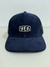 Boné Trucker Logo Assinatura
