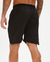 Short masculino oversized preto, visto de costas, destacando o design e a cintura elástica.
