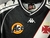 Camisa retrô do Vasco da Gama 2000 preta com faixa branca diagonal, patricinador Ace, logo da Kappa e escudo do Vasco. Detalhes da gola