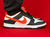 Dunk Low Preto e Laranja