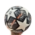 Bola de futebol da Champions League 2024, exibindo detalhes em preto e branco com estrelas e logotipo FIFA Quality.