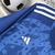 Camisa azul do Cruzeiro I 24/25 com detalhes em estrelas e logo da Adidas