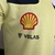 Camisa masculina verde da Ferrari 23/24 Fórmula 1, destacando o logo da Shell e Velas.