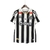 Camisa Santistas II 24/25 Torcedor Umbro Masculina na cor branca e preta, com listras verticais e patrocinadores visíveis.