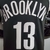 Camiseta regata masculina do Brooklyn Nets, preta com o nome "BROOKLYN" e o número "13" em destaque.