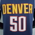 Camiseta regata azul marinho do Denver Nuggets, com o nome "DENVER" e o número "50" em destaque.