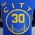 Camiseta regata azul dos Golden State Warriors com o logo "The City" e o número 30.