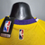 Camiseta regata amarela dos Los Angeles Lakers, com detalhes em roxo e etiqueta da NBA.