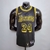 Camiseta regata preta dos Los Angeles Lakers com a numeração 24 e detalhes em amarelo, modelo Black Mamba da Nike.