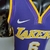 Camiseta regata roxa dos Los Angeles Lakers, modelo masculino, com gola V e logotipo da Nike.