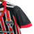 Camisa do Kit Infantil São Paulo Away 23/24 da Adidas, em vermelho e preto, com detalhes em preto e vermelho e logo do SPFC.