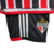 Detalhe do kit infantil São Paulo Away 23/24 da Adidas, com camisa vermelha e preta e logo do time.