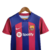 Camisa do Kit Infantil do Barcelona, modelo 23/24, nas cores azul e grená, com logo da Nike e Spotify.